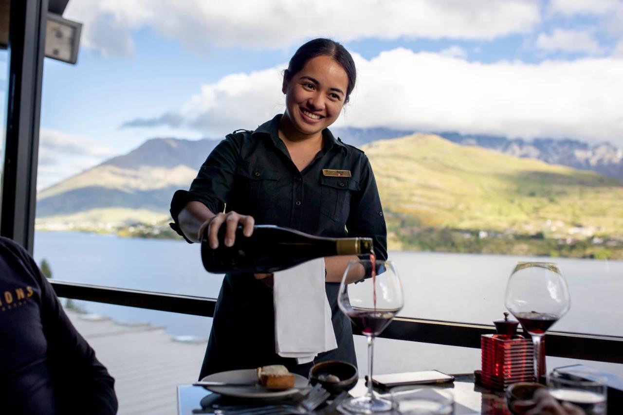 The Rees Hotel & Luxury Apartments Квинстаун Экстерьер фото A waitress serving wine at a restaurant