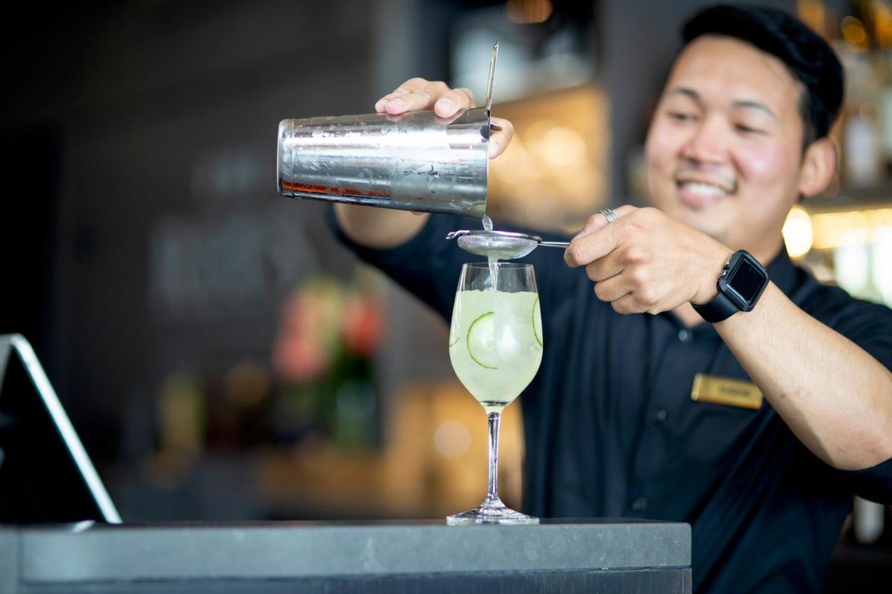 The Rees Hotel & Luxury Apartments Квинстаун Экстерьер фото Bartender at work